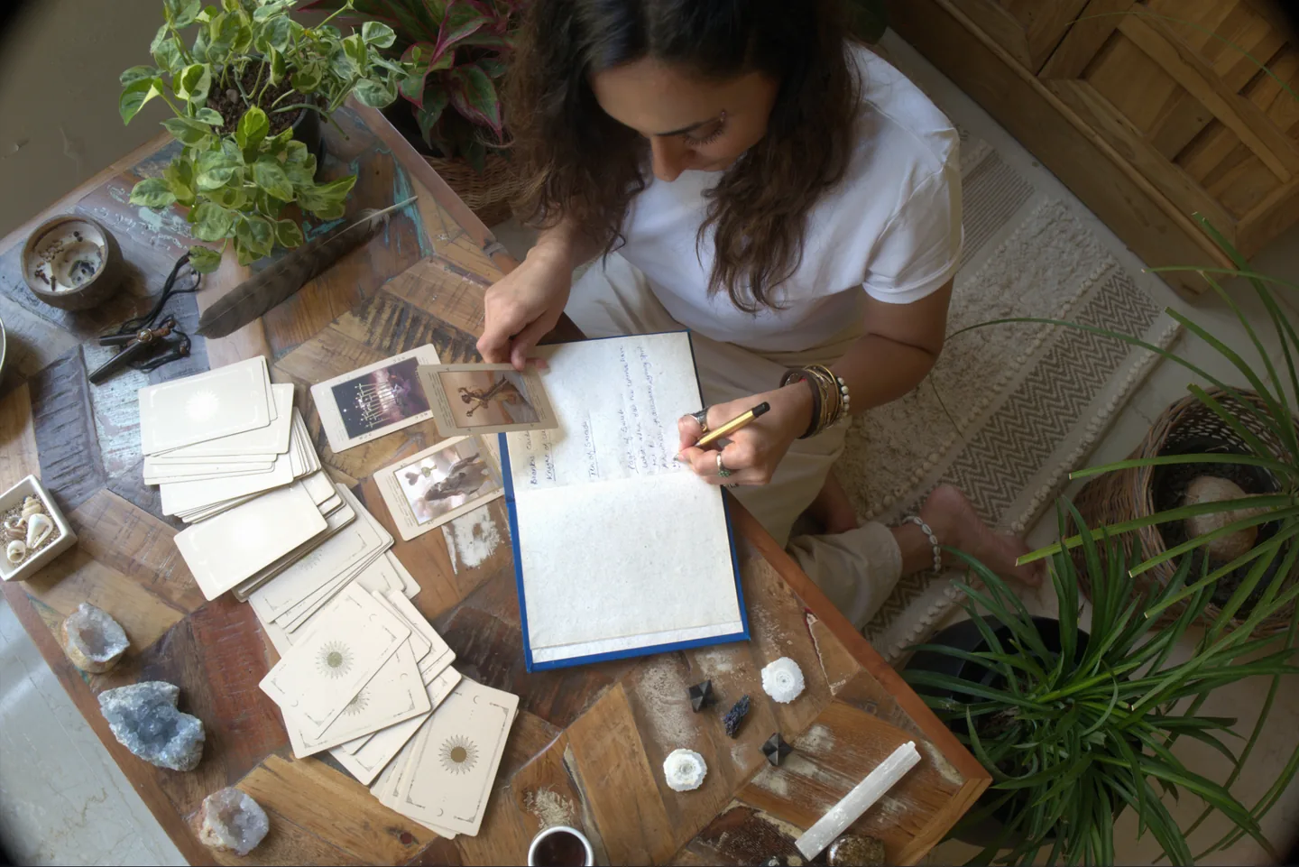 Sabah writing in a notebook during a reflective practice