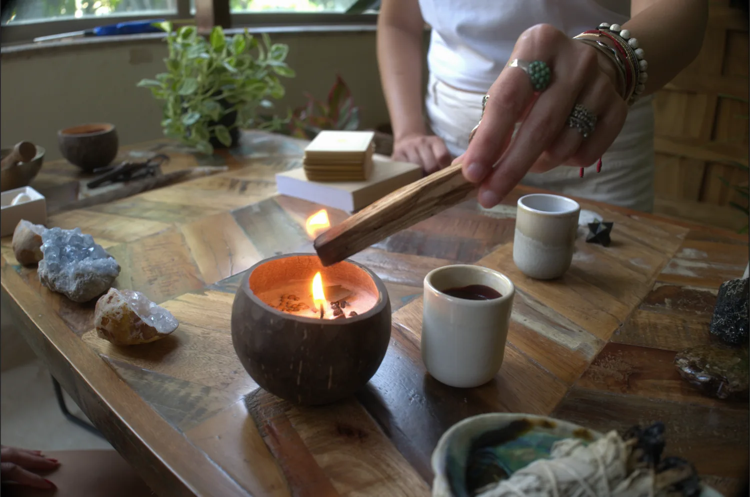 Sabah holding a reflective ritual object